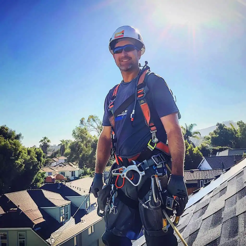 Flat Top roofing image of roofer smiling at the camera